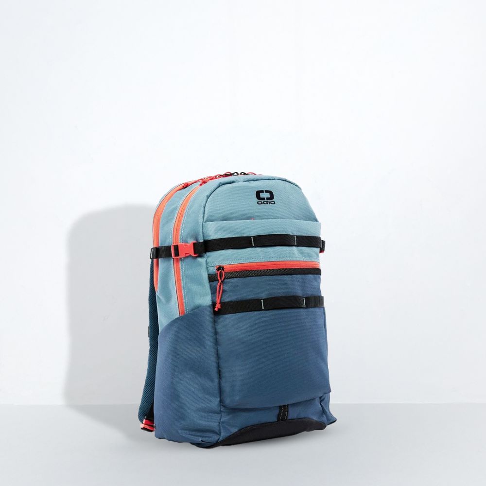 Blue backpack with red and black accents on a light gray background