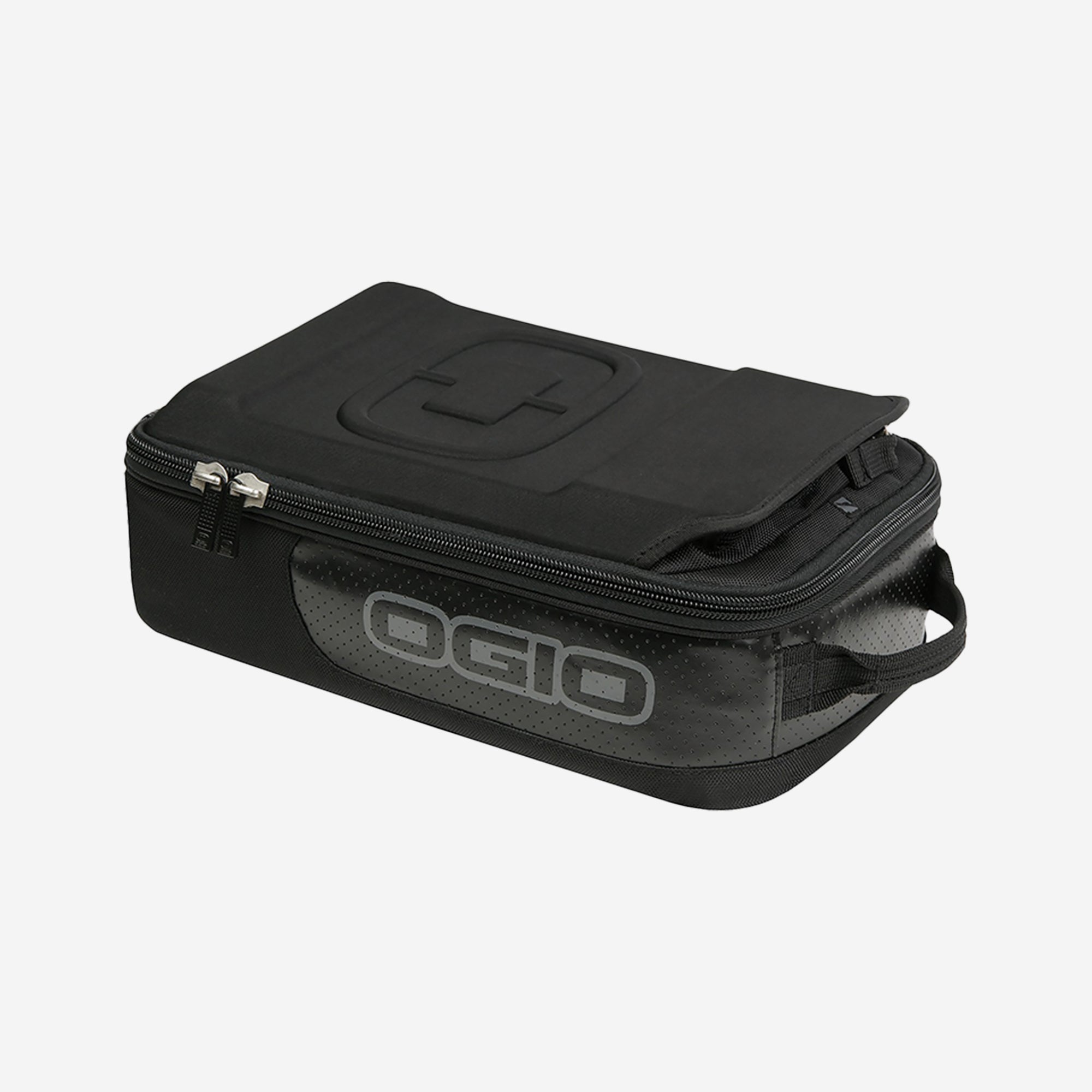A black OGIO branded ski goggle box with a fleece-lined interior.