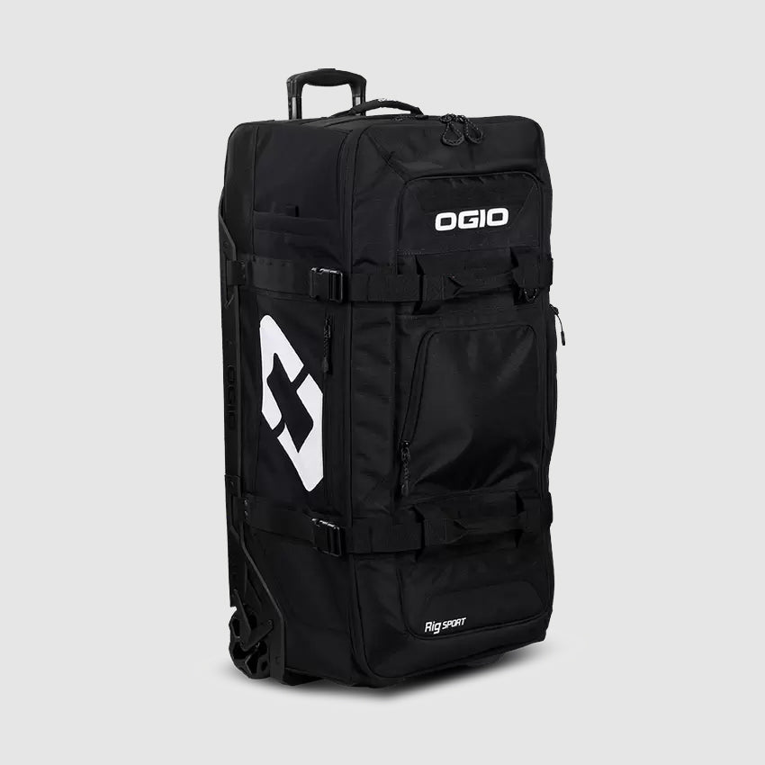 A black OGIO travel bag with multiple compartments and wheels for mobility.