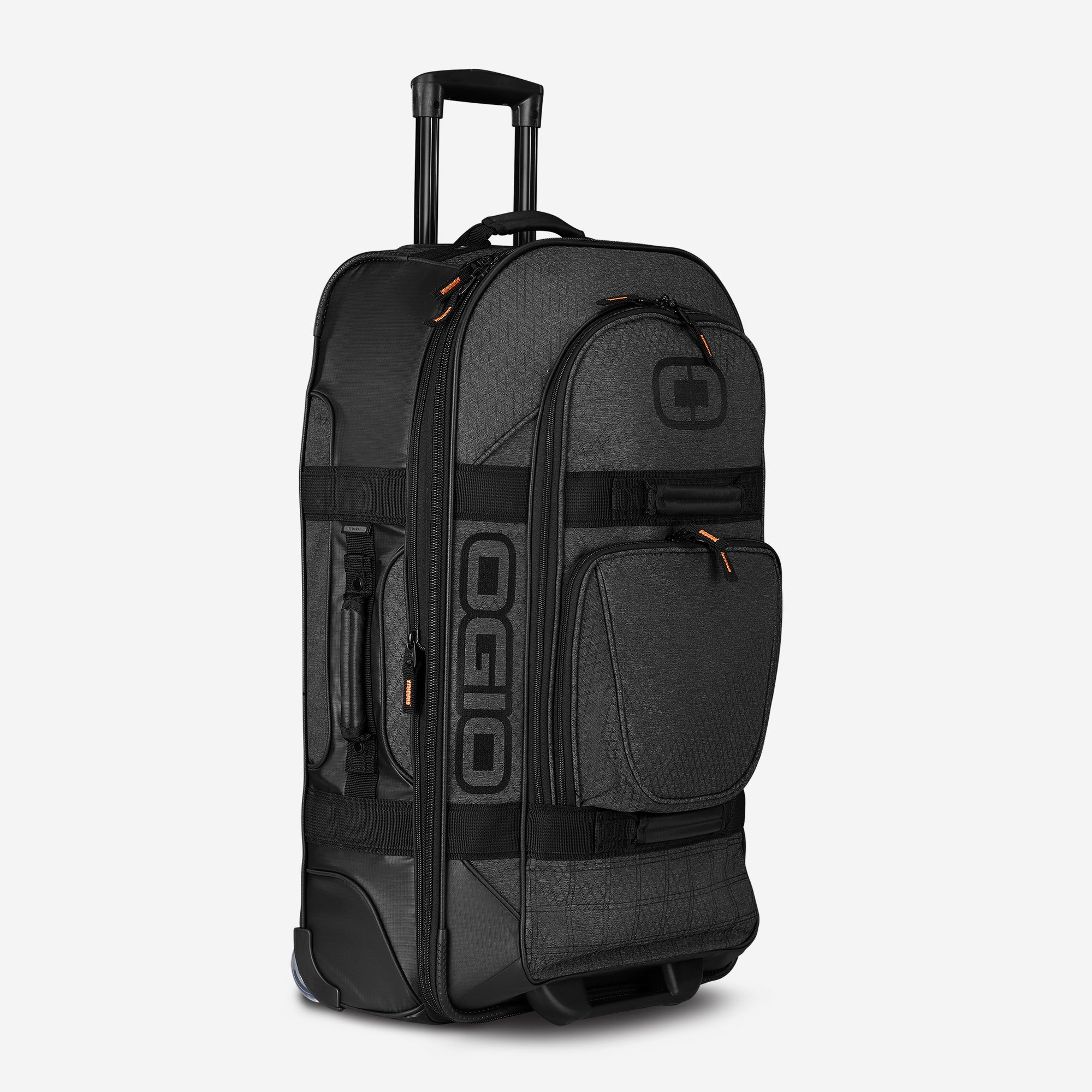 A graphite-colored Terminal Travel Bag with multiple compartments and a telescoping handle.