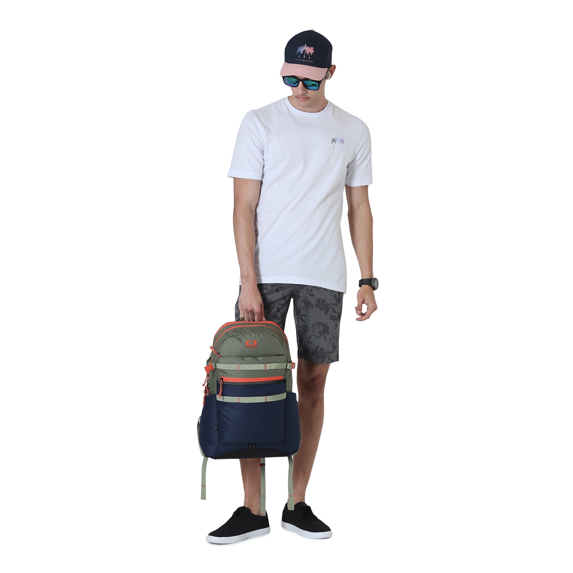 Man carrying OGIO Alpha 20L Backpack in Midnight Olive