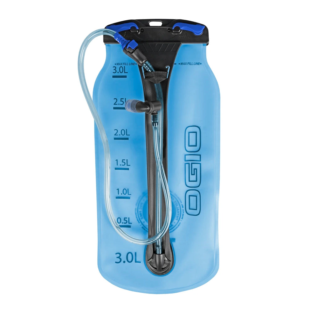 A blue hydration reservoir bag with OGIO branding, measurement markings, and a bite valve.