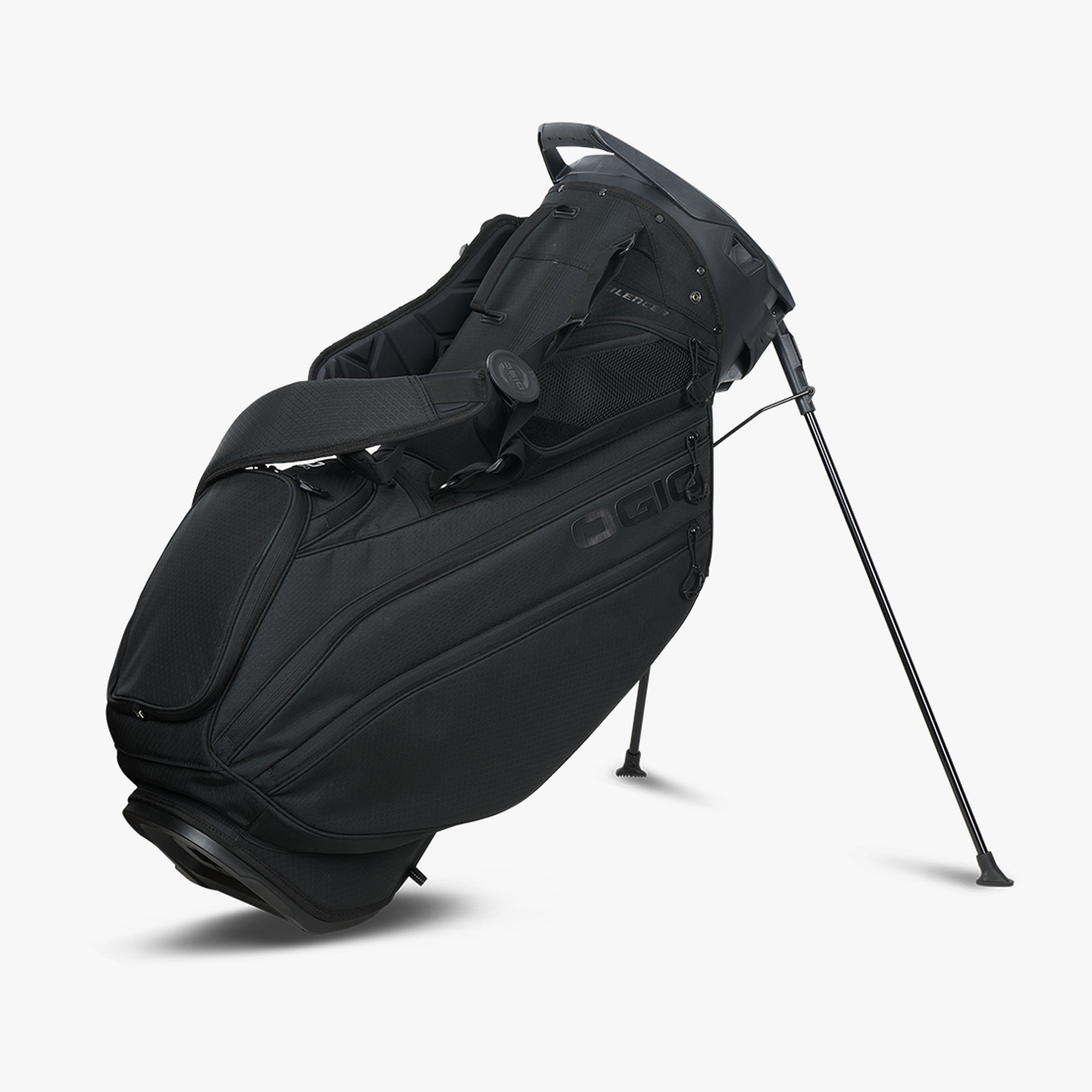 A black OGIO Silencer Hybrid stand golf bag on a stand, featuring multiple compartments and a shoulder strap.