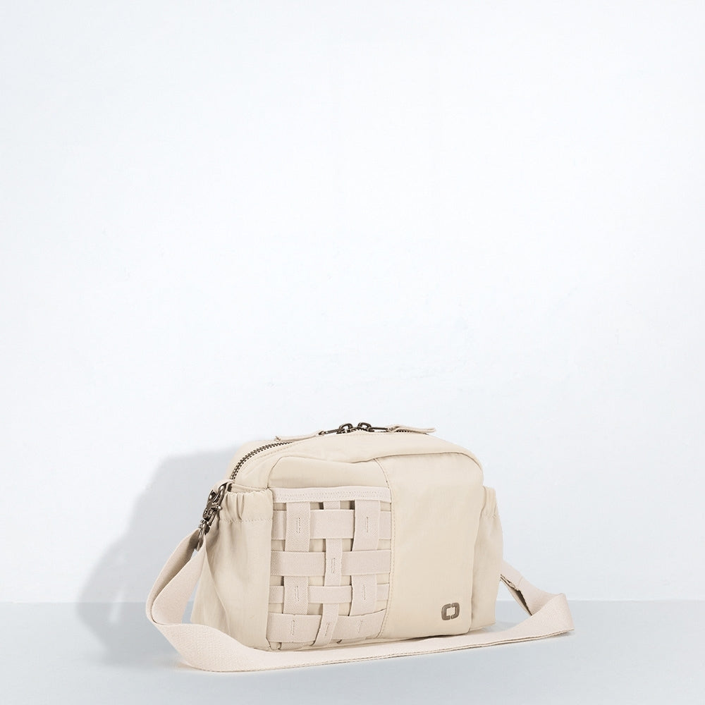 Beige shoulder bag with woven pattern on a light gray background