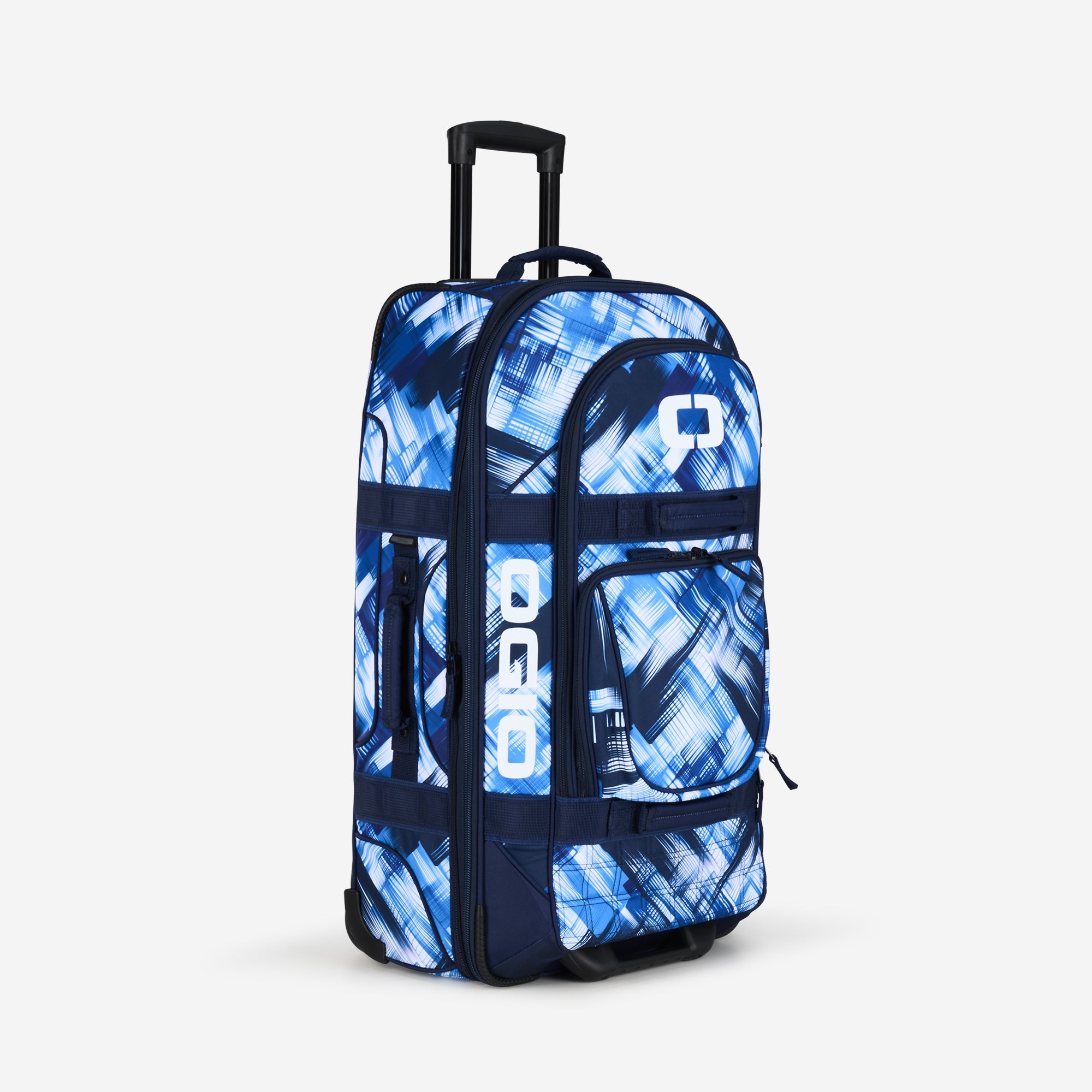 A blue checkered pattern travel bag with wheels and multiple compartments.