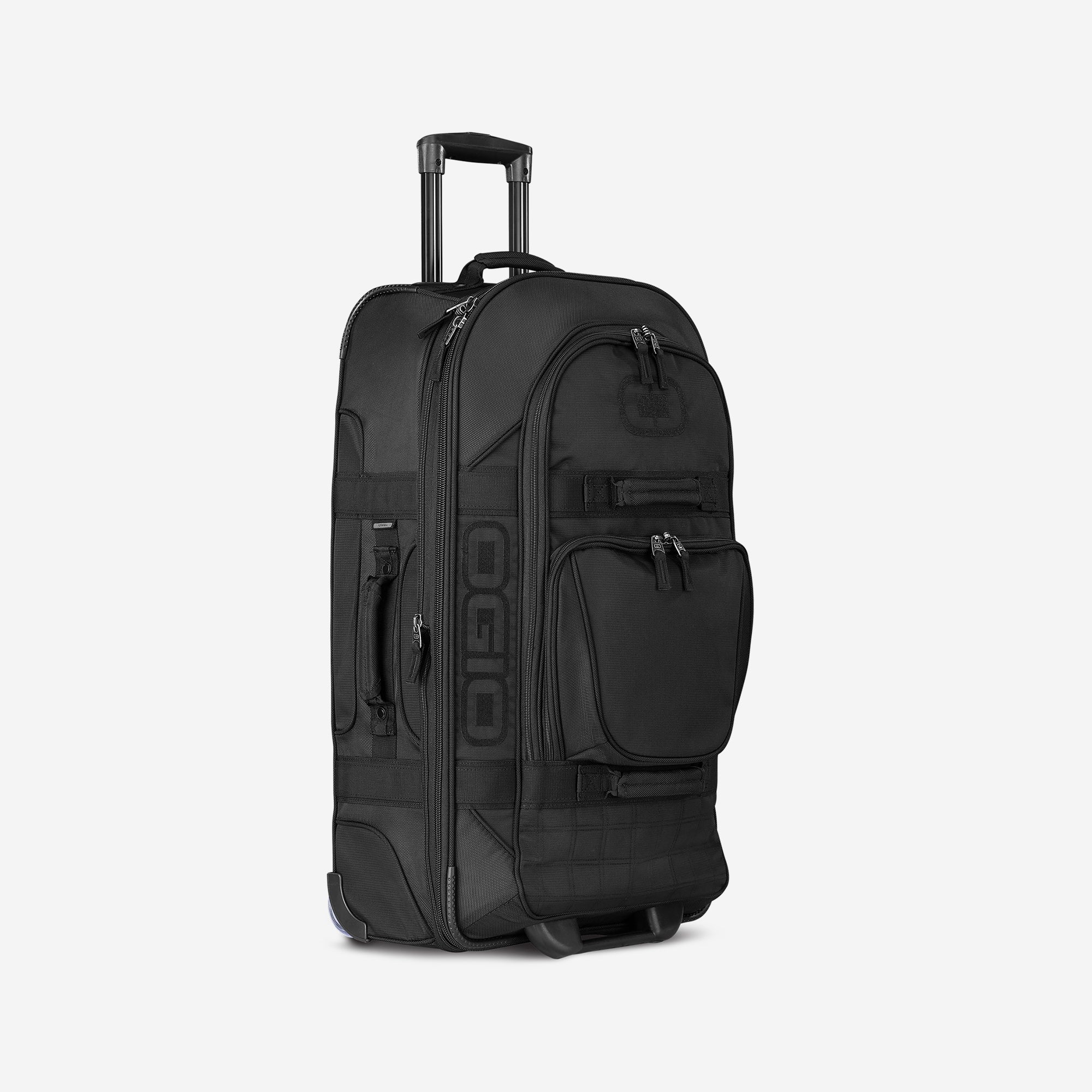 A black Terminal Travel Bag with wheels and multiple compartments.