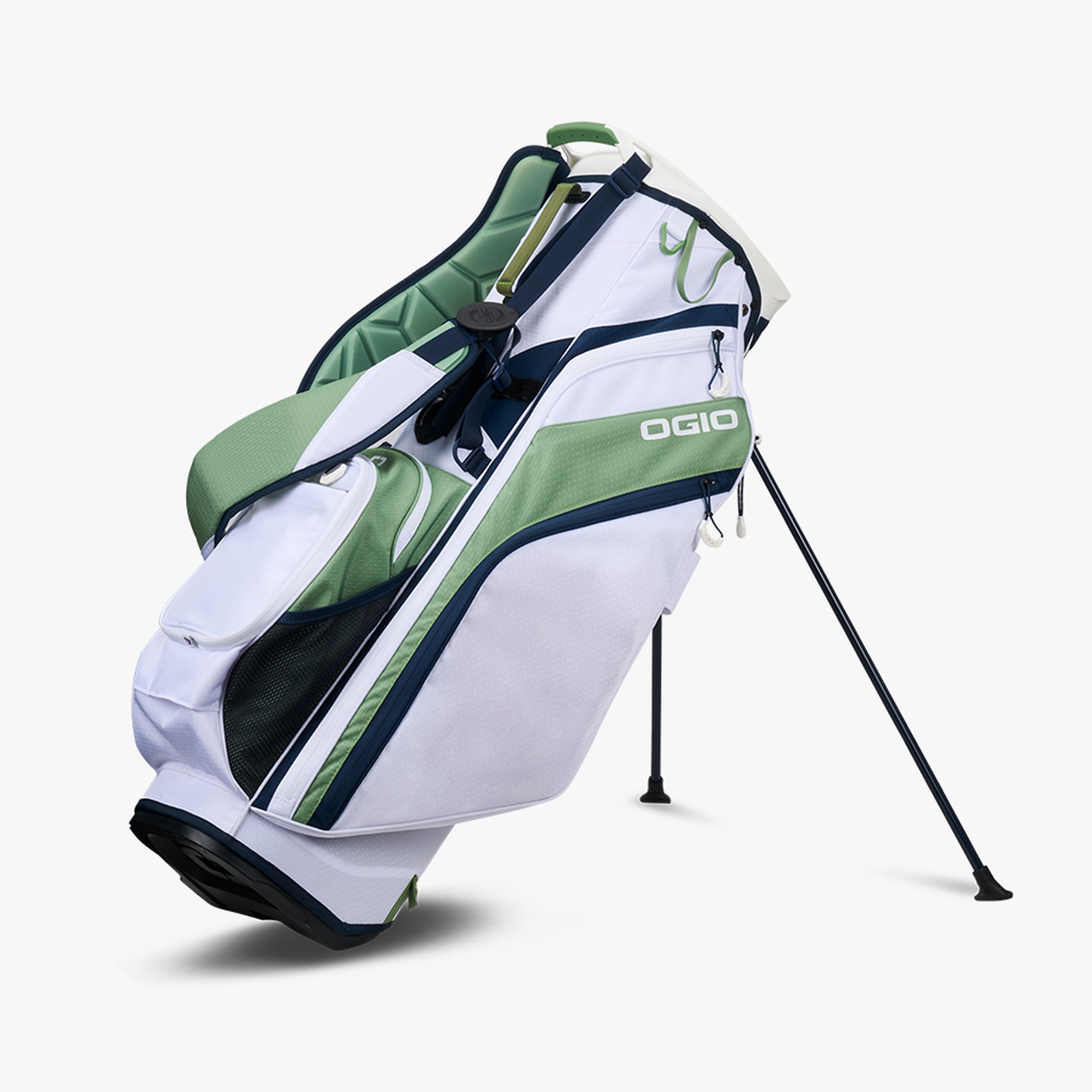 OGIO branded golf bag with white, green, and black colors, featuring a stand mechanism and over-molded top.