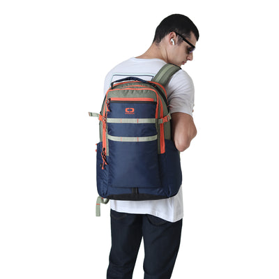 Man wearing OGIO premium backpack in HYPER CAMO with orange accents